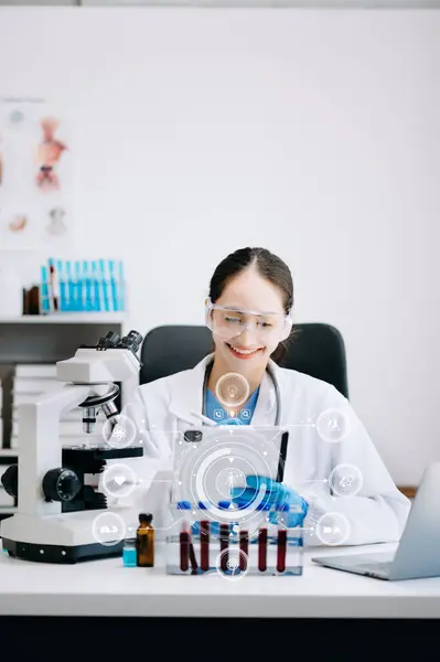 Doctor using microscope in laboratory and  study with virtual icon