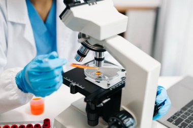 Scientist mixing chemical liquids in the chemistry lab. Researcher working in the chemical laboratory