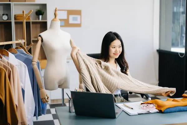 Stock image Fashion blogger concept, Young Asian woman selling clothes on video streaming. Startup small business SME