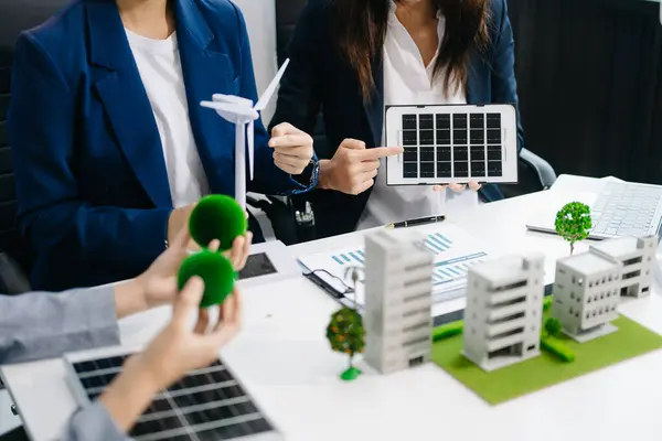 stock image Business people having consultation about wind energy at company office. Business team discussing about windmills and alternative green energy. Executive meeting at office 