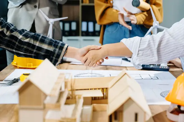 stock image Engineer team hardworking to consults about building project, business people shaking hands 