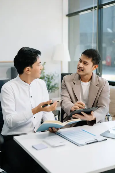 stock image Businessmen work and discuss their business plans