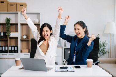 Businesswomen work and discuss their business plans in office 