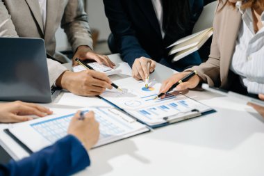 Business People Planning Strategy Analysis Office Concept. writing notes about sticky notes Laptop,tablet  Planning and Brainstorming Strategies of Colleagues
