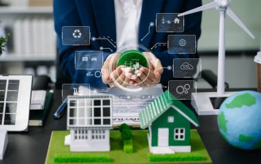 Dünya modelini elinde tutan bir iş adamı. NET Sıfır simgeleri ve sembolleri eko dünyasını kurtarır ve kirliliği azaltır. yeşil enerji kavramı 