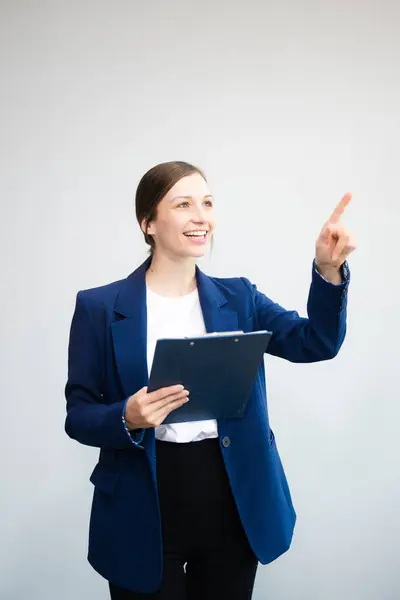 stock image Confident Caucasian businesswoman in formal suit holding documents and point finger up isolated on white background 