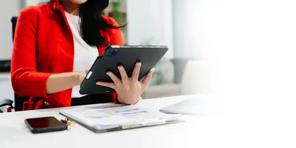 Stock image Mod section of Businesswoman using tablet in office 