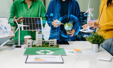 Business team working virtual modern smartphone to reduce CO2 emissions carbon footprint climate change to limit global warming.Sustainable development and green business concept. at offic