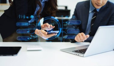 ESG concept of environmental, Green ethical business preserving resources, reducing CO2, Business person team working on laptop virtual smartphone 