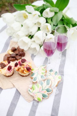 delicious cake with flowers and fruits on table