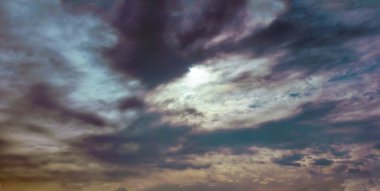 Summer blue sky with a gradient of clouds on a light white background. The beauty of a clear cloudy in the sunlight calm bright background of winter air.