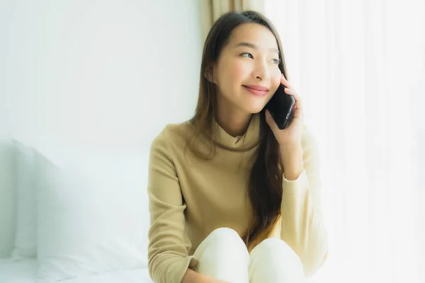 Young Asian Woman Using Mobile Smart Phone Bed Bedroom Interior — Stock Photo, Image