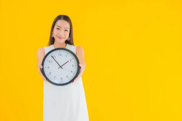 Portrait Beautiful Young Asian Woman Alarm Clock Yellow Isolated Background — Stock Photo, Image