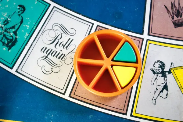 stock image London, UK - 07 April 2019: A board games tournament - Overhead close-up shot of classic board game Trivial Pursuit with colored plastic pieces of different colors