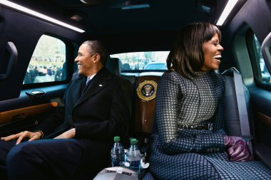 Washington D.C., USA - Jan 21 2013: President Barack Obama and First Lady Michelle Obama ride in the inaugural parade clipart