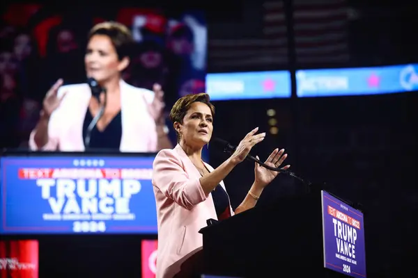 stock image Glendale, Arizona, USA - 23 August 2024: Republican nominee Kari Lake speaking behind a podium at a political campaign rally in an arena, endorsing the Trump Vance presidential candidate race (by Gage Skidmore)