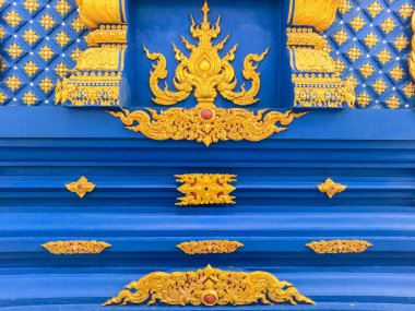 Chiang Rai Tayland 'daki Wat Rong Suea On Mavi Tapınağı' nın altın ayrıntıları.