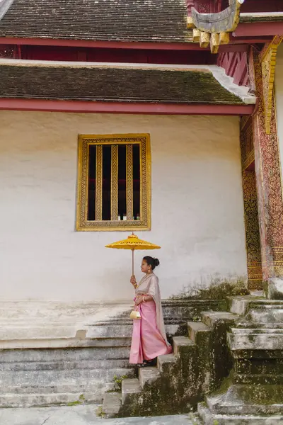 South Asian girl in Wat Phra Singh Temple in Thai costume Chiang Mai Thailand