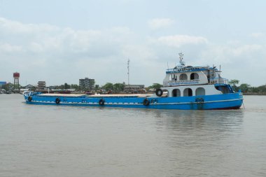 Cargo ship or container vessel in a river in Bangladesh clipart