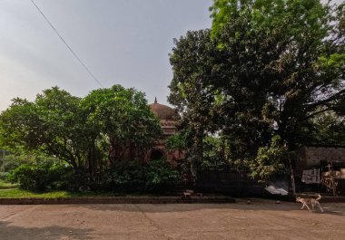 Shahbaz Khan Mosque visible from its surrounding landscape clipart