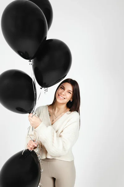 Portrait Young Brunette Holding Bunch Black Balloons Isolated White Background —  Fotos de Stock
