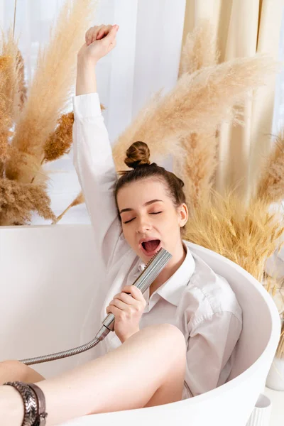 Beautiful Teenage Girl Sitting Bathtub Singing Using Shower Head Having — 스톡 사진