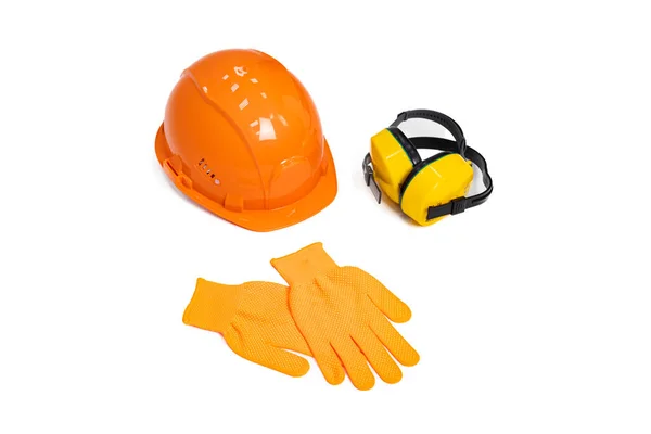 stock image Set of worker's safety gear. Protective equipment. Essential items. Orange work helmet, noise-cancelling headphones, and work gloves on a white isolated background. Copy space.