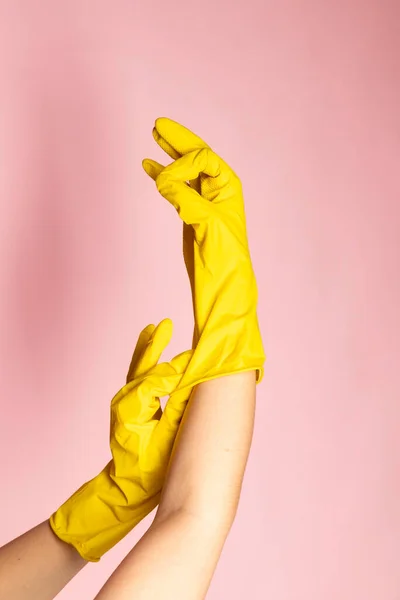 Close-up of hands in chemical protection gloves.