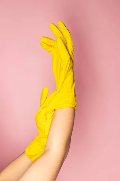 Close-up of hands in chemical protection gloves.
