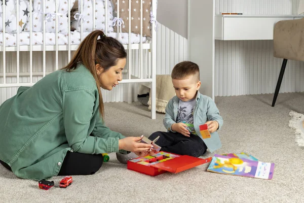 Mother Her Little Son Playing Toys Reading Colorful Books Children — Stock Photo, Image