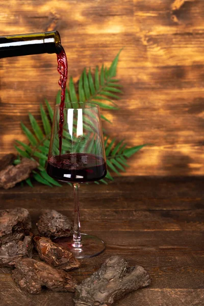 Wine Pouring Glass Wooden Background Plant Leaves Branches — Stock Photo, Image