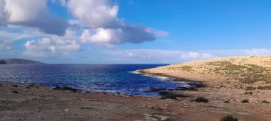 Cliffs on the Mafa Peninsula. The northern tip of Malta located on the Mediterranean Sea. clipart
