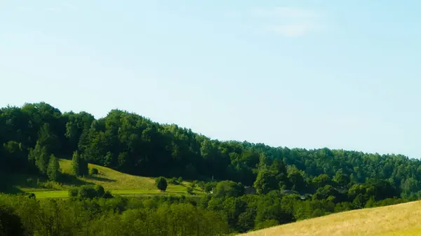 stock image Landscape of meadow and hills in Wiezyca, Kashubian Region, Poland. Tourism and exploration concept.