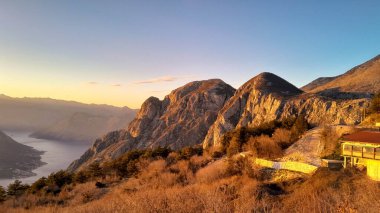 Lovcen mountain peaks on a sunny day. The Lovcen Mountains lie around Boka Kotorska in Montenegro. Montenegro is a popular tourist destination in the Balkans. clipart