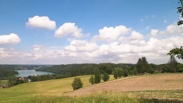 stock image View of hills, meadows, and beautiful Ostrzyckie Lake, Kashubia, Poland.