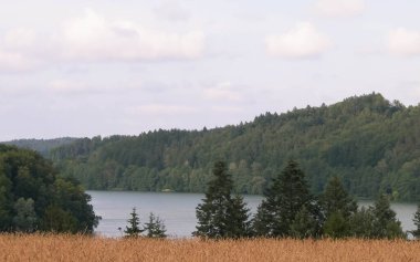 Ostrzyckie Lake in Wiezyca. Kashubia Region in Northern Poland is very popular touristuc direction in summer and winter. clipart