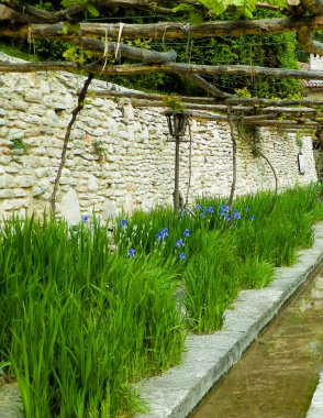 Stream in gardens of the Balchik Palace. Traveling and exploration concept. clipart