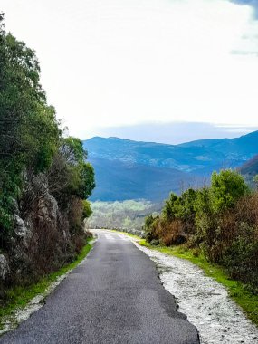 Road across Rumija Mountains near Lake Skadar. Montenegro outside the tourist season. clipart