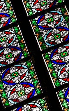 Stained glass as architecture background. Arch-see in Frombork. Art background. St. Andrew in Frombork Cathedral. clipart