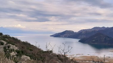 Lovcen mountains and Skadar Lake in Montenegro. Beauty of nature. Autumn season. clipart