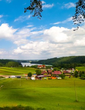 Mountain landscape of Kashubia. Agriculture, hills and ski slopes in summer. clipart