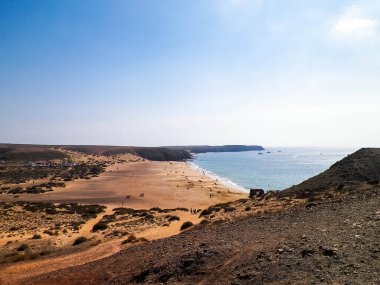 Cliff near Popagayo Beach. Lanzarote Island. Canarian Archipelago. Popular touristic attraction.