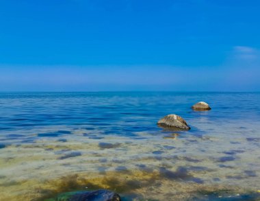 Seascape of Baltic Sea crystal water, rocks, seaweed and sea bottom. Oslonino near Puck in Poland.