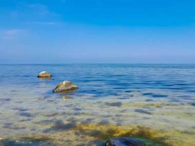 Seascape of Baltic Sea crystal water, rocks, seaweed and sea bottom. Oslonino near Puck in Poland.