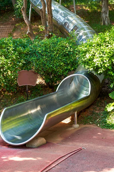 Stainless steel cylinder slide in the park playground