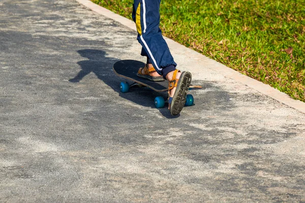 A child skateboards in the park