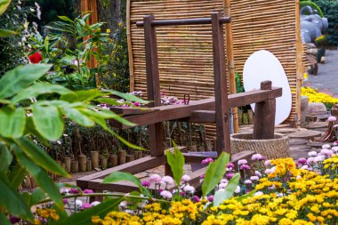 Close-up of agricultural implements placed in a rural chrysanthemum garden