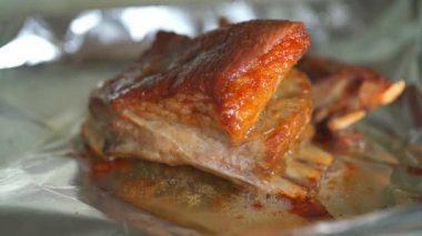 A golden and tempting crispy grilled lamb chop cooking in the oven