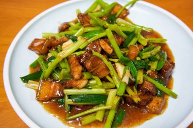 A delicious home-cooked dish, stir-fried pork belly with celery