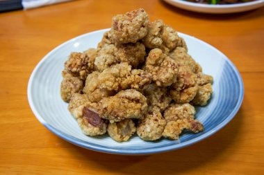 A plate of crispy and delicious fried crispy meat close-up